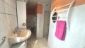 gefliestes Duschbad in der Einliegerwohnung